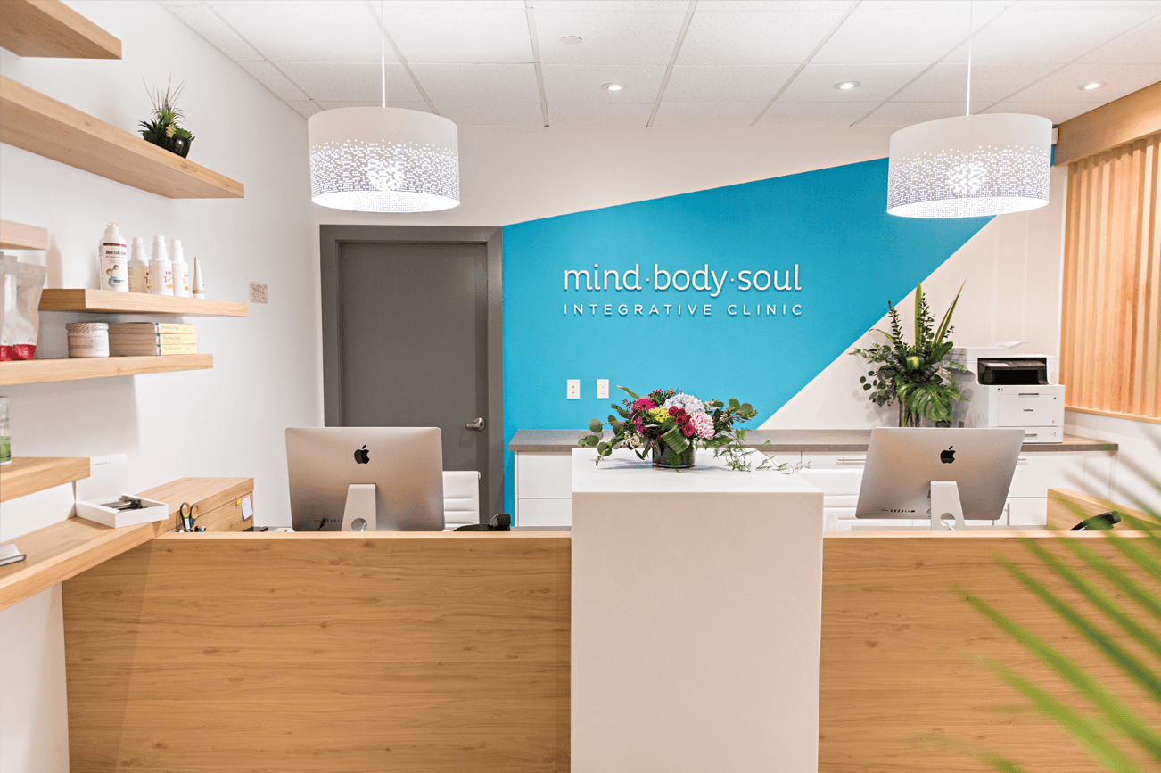 Mind Body Soul Clinic Front Reception Desk with Lights and wooden accents