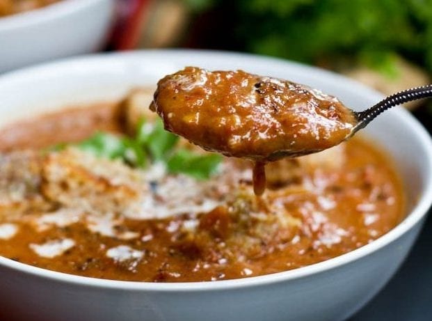 spoon and bowl of Creamy Roasted Tomato Soup
