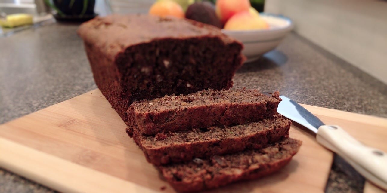 Gluten-Free Vegan Zucchini Apple Bread sliced on cutting board