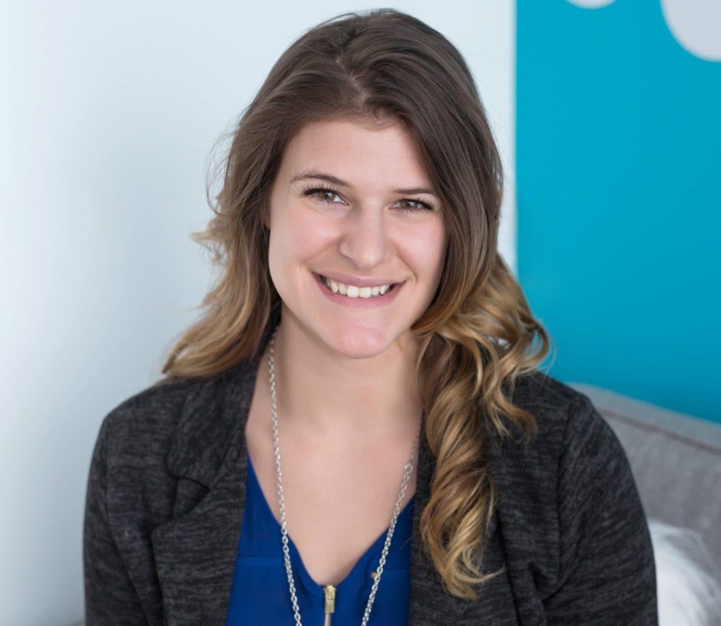 Jessika Robertson is our office assistant, shown here with a blue shirt and grey blazer