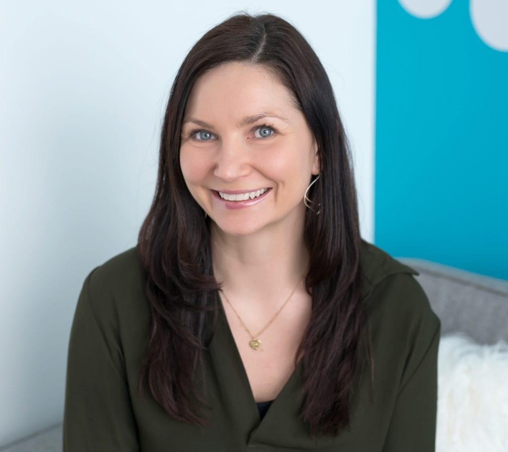 Tara Irwin is our clinical counsellor, shown here with long dark hair and a deep green blouse