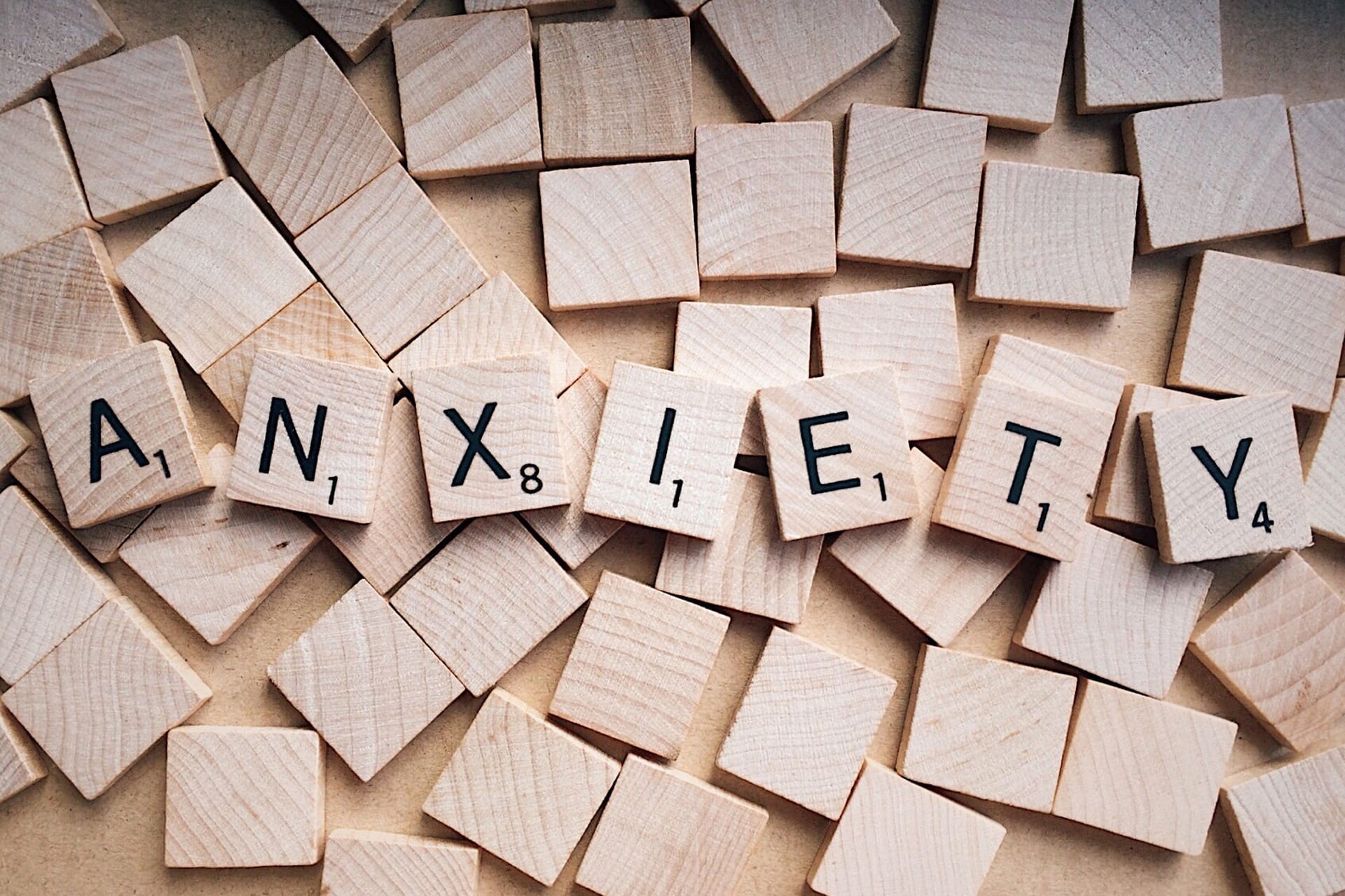 Scrabble pieces spelling out the word anxiety, highlighting the topic of this piece, managing anxiety